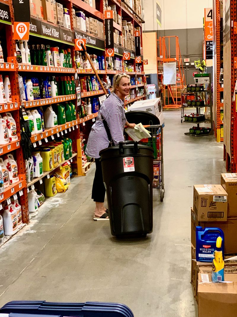 The greatest mother to have ever done it hauling her offspring's garbage through Home Depot®.